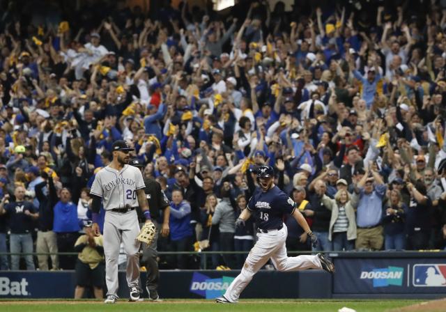 Milwaukee, WI, USA. 10th Apr, 2016. Barrelman waves to fans on the top of  dugout prior to the Major League Baseball game between the Milwaukee Brewers  and the Houston Astros at Miller