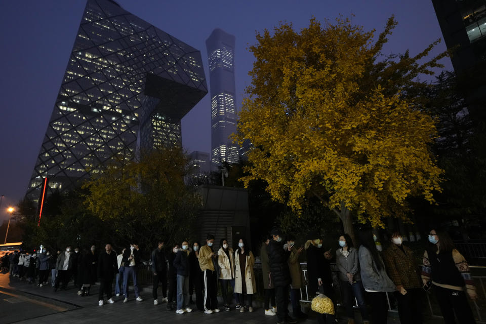 Residents wearing masks line up for COVID test in Beijing, Thursday, Nov. 10, 2022. (AP Photo/Ng Han Guan)