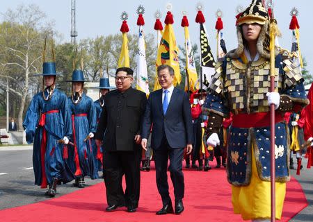 South Korean President Moon Jae-in and North Korean leader Kim Jong Un meet in the truce village of Panmunjom inside the demilitarized zone separating the two Koreas, South Korea, April 27, 2018. Korea Summit Press Pool/Pool via Reuters