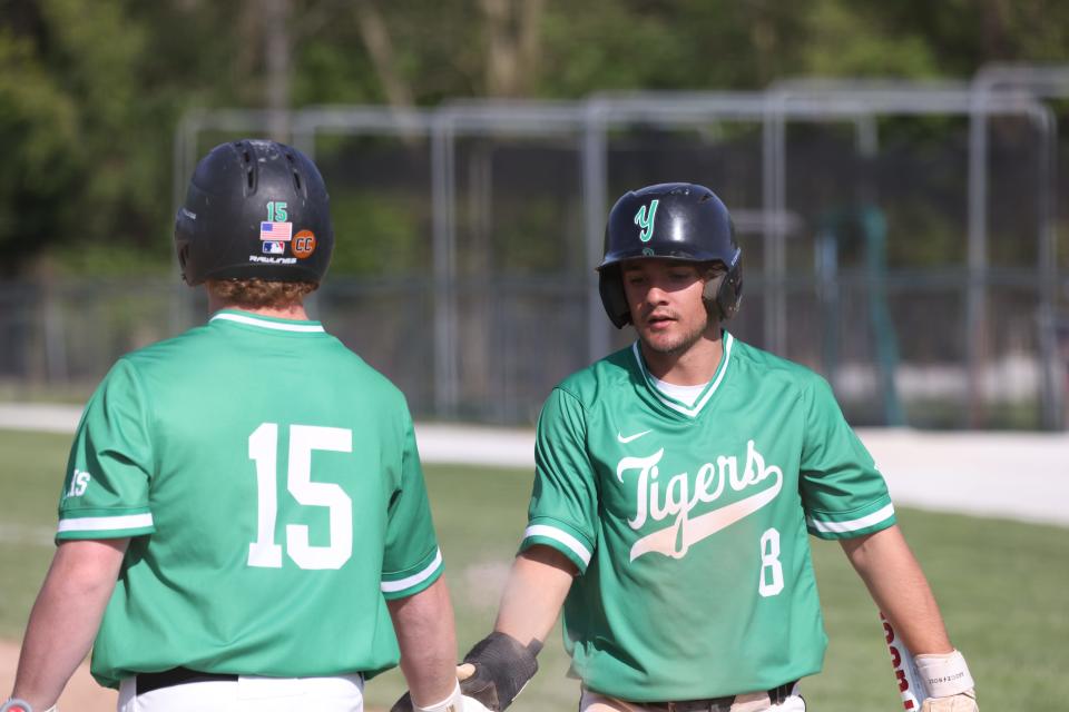 Yorktown baseball's Cole Temple (right) in the team's game against Wapahani in the Delaware County tournament semifinals on Thursday, May 11, 2023.