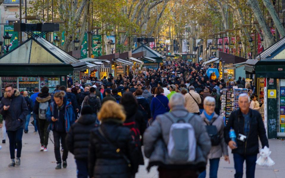 Crowds walking on the Rambla of Barcelona - Getty