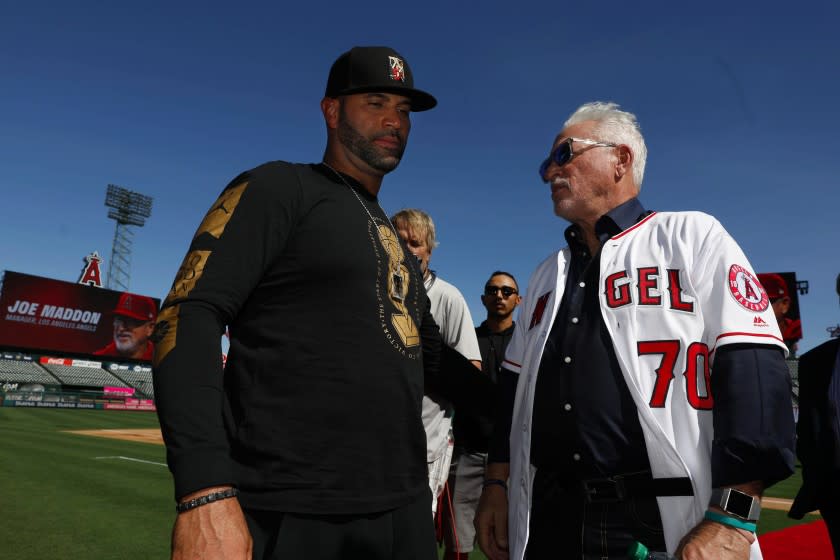 JOE MADDON, right, shown with Albert Pujols