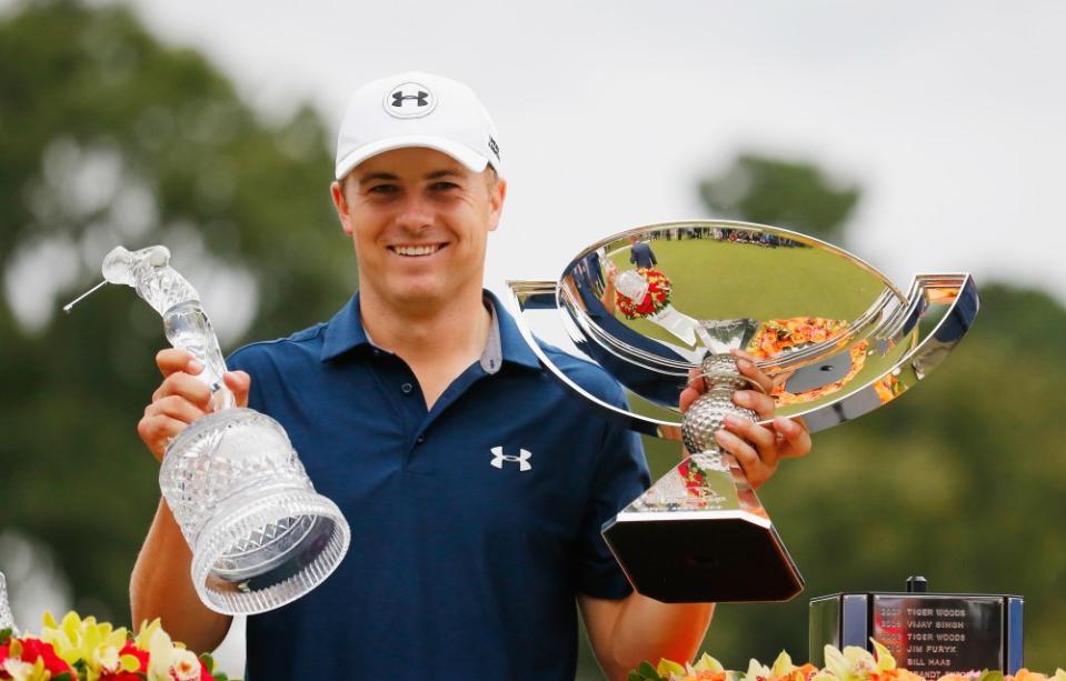 Jordan Spieth of the United States poses on the 18th green after winning both the TOUR Championship By Coca-Cola and the FedExCup at East Lake Golf Club on September 27, 2015, in Atlanta, Georgia (Photo by Kevin C. Cox/Getty Images)