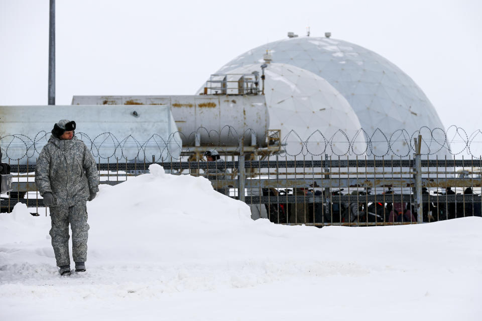 A soldier walks at a radar facility on the Alexandra Land island near Nagurskoye, Russia, Monday, May 17, 2021. Once a desolate home mostly to polar bears, Russia's northernmost military outpost is bristling with missiles and radar and its extended runway can handle all types of aircraft, including nuclear-capable strategic bombers, projecting Moscow's power and influence across the Arctic amid intensifying international competition for the region's vast resources. (AP Photo/Alexander Zemlianichenko)