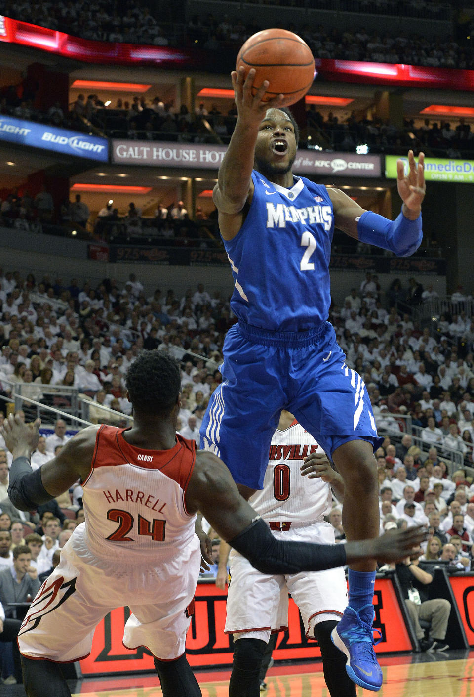 Memphis' Shaq Goodwin, right, shoots over the attempted block of Louisville's Montrezl Harrell during the first half of an NCAA college basketball game on Thursday Jan. 9, 2014, in Louisville, Ky. (AP Photo/Timothy D. Easley)