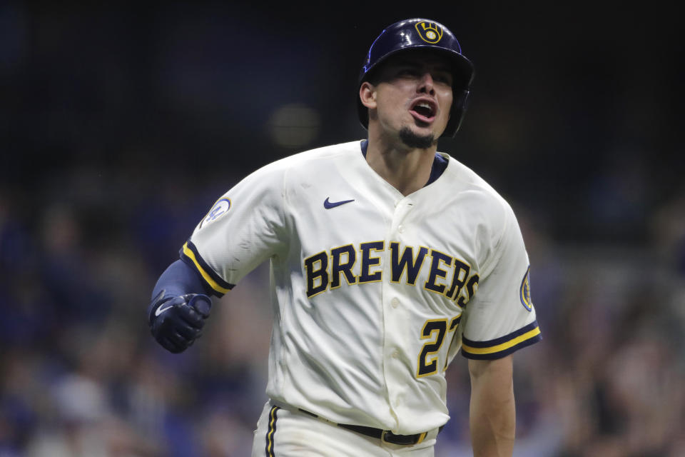 Milwaukee Brewers' Willy Adames reacts after hitting a three-run home run during the eighth inning of a baseball game against the Chicago Cubs, Monday, June 28, 2021, in Milwaukee. (AP Photo/Aaron Gash)