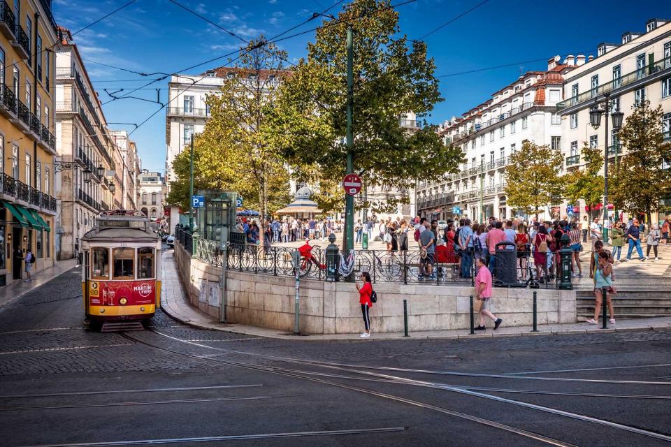 The architecture of Lisbon in Portugal with its ancient building in baroque style, cobblestone streets, and a sunny summer day.