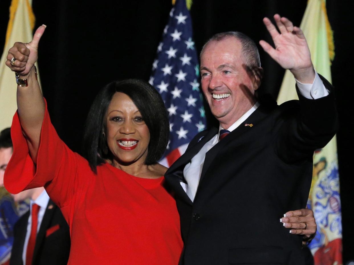 <p>Phil Murphy celebrates with his running mate, Lieutenant Governor-elect Sheila Oliver, after he was elected Governor of New Jersey in Asbury Park</p> (Lucas Jackson/Reuters)