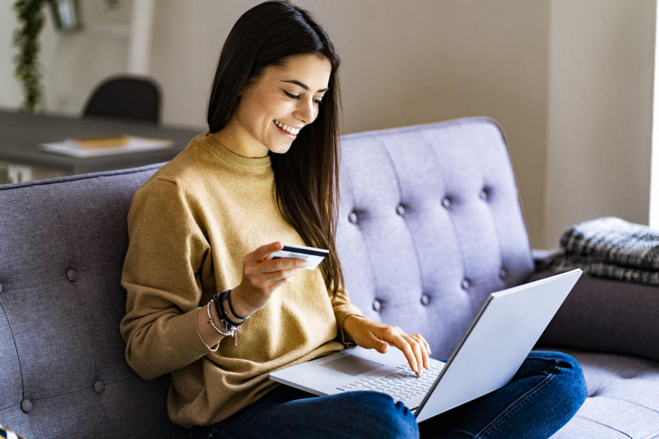 Woman smiling while online shopping