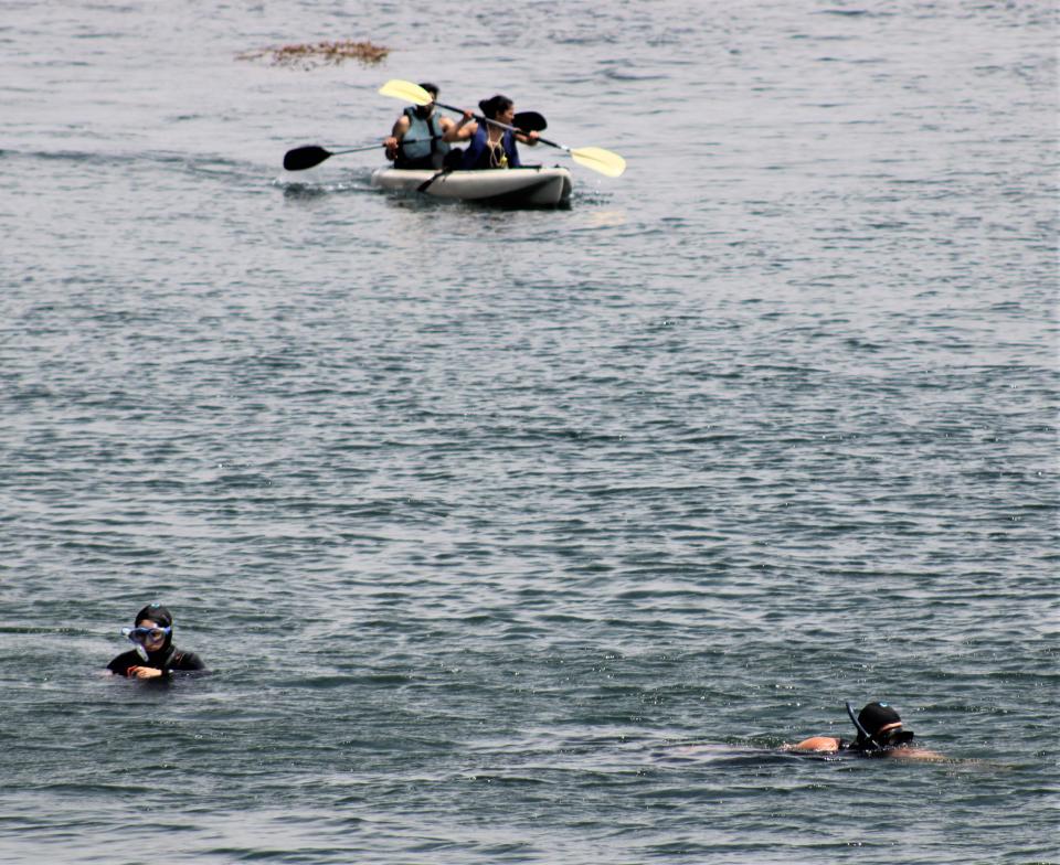 Visitors enjoy kayaking and snorkeling off Santa Cruz Island.