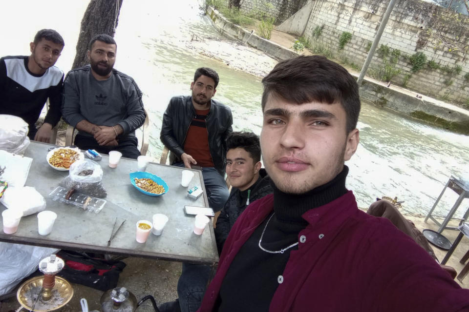 In this photo provided by a relative, Ali Sheiki, 29, second left, and his younger brother, Mohamed Sheiki, 20, right, appear in March 2023 in Lebanon with other fellow Syrians who were hoping to settle in Europe. The five men embarked on June 9, 2023, on a fishing vessel that was supposed to take them from eastern Libya to Europe, but that eventually capsized and sank in the Mediterranean in the early hours of June 14, 2023. Relatives of the Sheiki brothers interviewed by The Associated Press in Syria and in Germany said they had recognized Ali Sheiki among the survivors taken to a southern Greek port in photographs published on social and other media. (Courtesy of family of Ali Sheiki via AP)