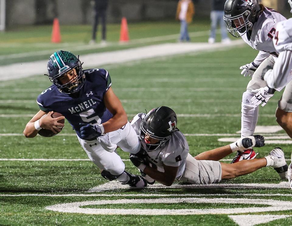 McNeil quarterback Jarell Gary dives toward the end zone as the Mavericks defeat the Bowie Bulldogs 17-14 for a Class 6A Division 2 bi-district title win Friday at Kelly Reeves Athletic Complex.