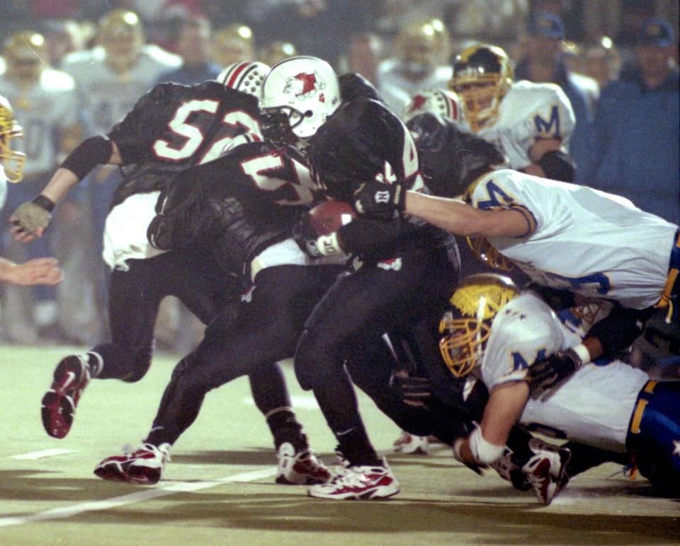 DeMarlo Rozier runs the ball for McKinley during its win over Cincinnati Moeller in the 1997 Division I state championship game at Paul Brown Tiger Stadium in Massillon.