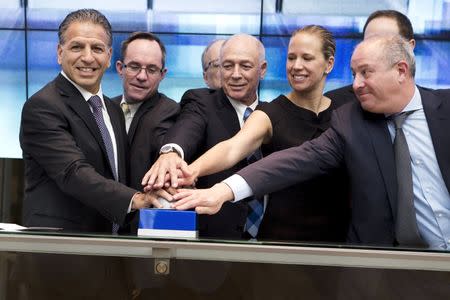 Robert J. Coury, Chairman and Chief Executive Officer of Mylan (L) participates in a bell ringing ceremony with officials at the Tel Aviv Stock Exchange, Israel November 4, 2015. REUTERS/Nir Elias