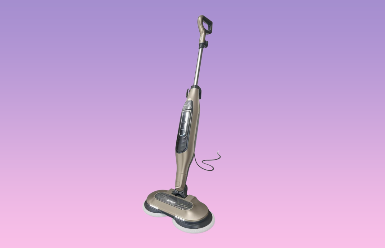 Shark steam mop on purple background. 