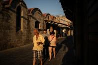 People make their way in the Old Town of Rhodes, following the coronavirus disease (COVID-19) outbreak, on the island of Rhodes