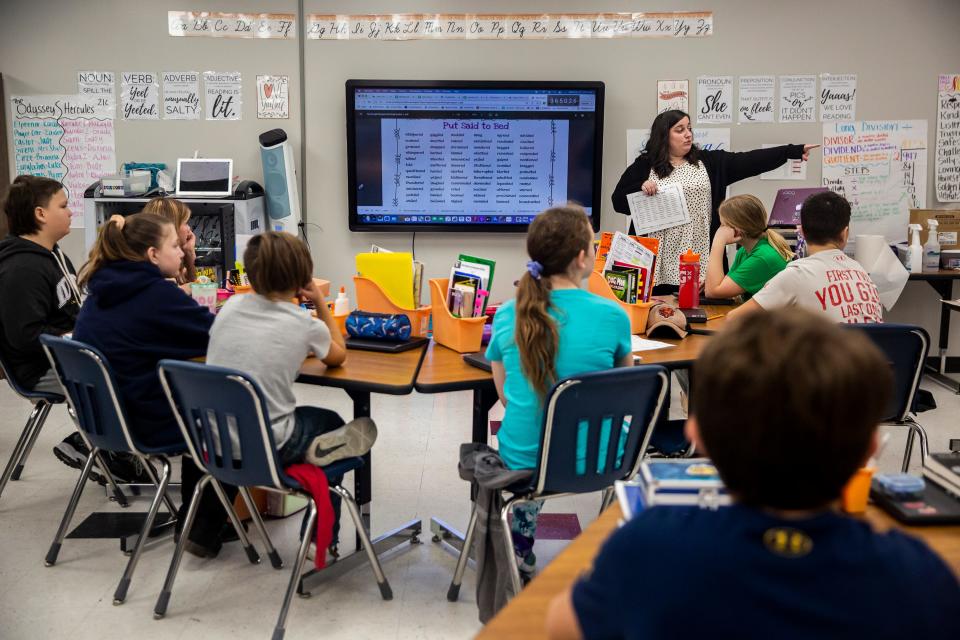 Shelby Shull teaches how to write dialogue to her class of sixth-grade students Wednesday at Cardinal Middle School in Eldon. The district is considering moving to a four-day school week starting next year.