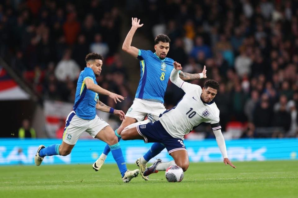 Bellingham is fouled by Lucas Paqueta, who was lucky to stay on (Getty Images)