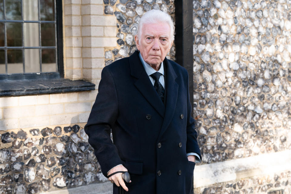 Alan Ford as Stevie Mitchell in EastEnders. He is wearing a black suit and holds a walking stick.