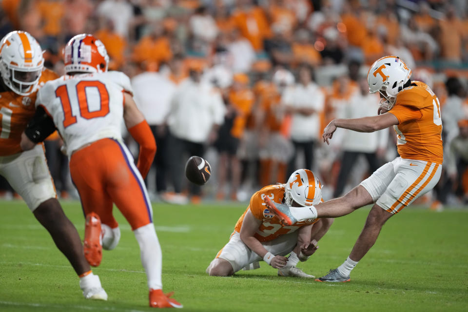 Tennessee' Chase McGrath (40) kicks an extra point from the hold of Paxton Brooks (37) during the first half of the team's Orange Bowl NCAA college football game against Clemson, Friday, Dec. 30, 2022, in Miami Gardens, Fla. (AP Photo/Rebecca Blackwell)