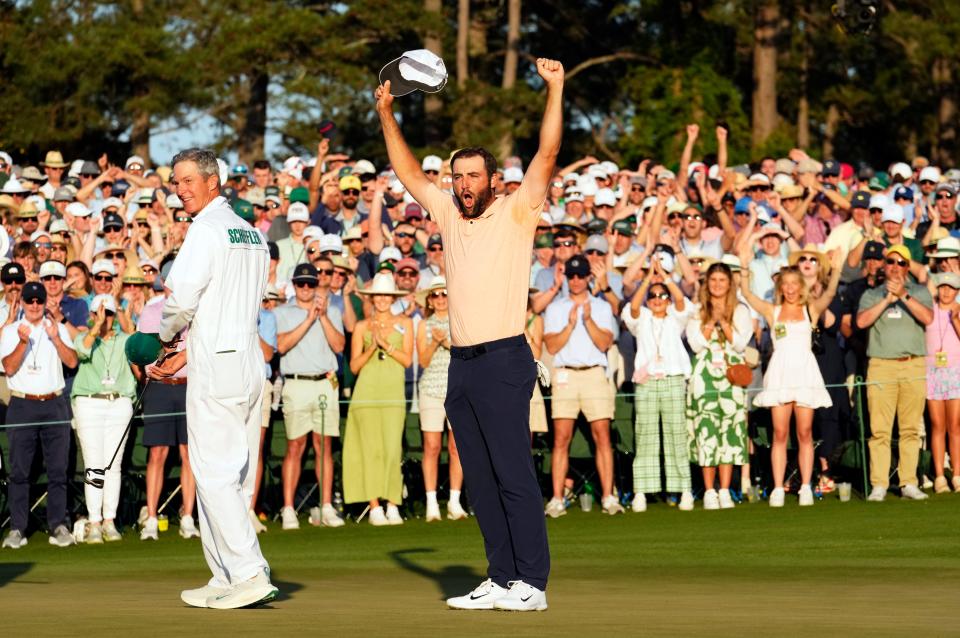 Scottie Scheffler celebrates on the 18th green Sunday after winning the 88th Masters Tournament.
