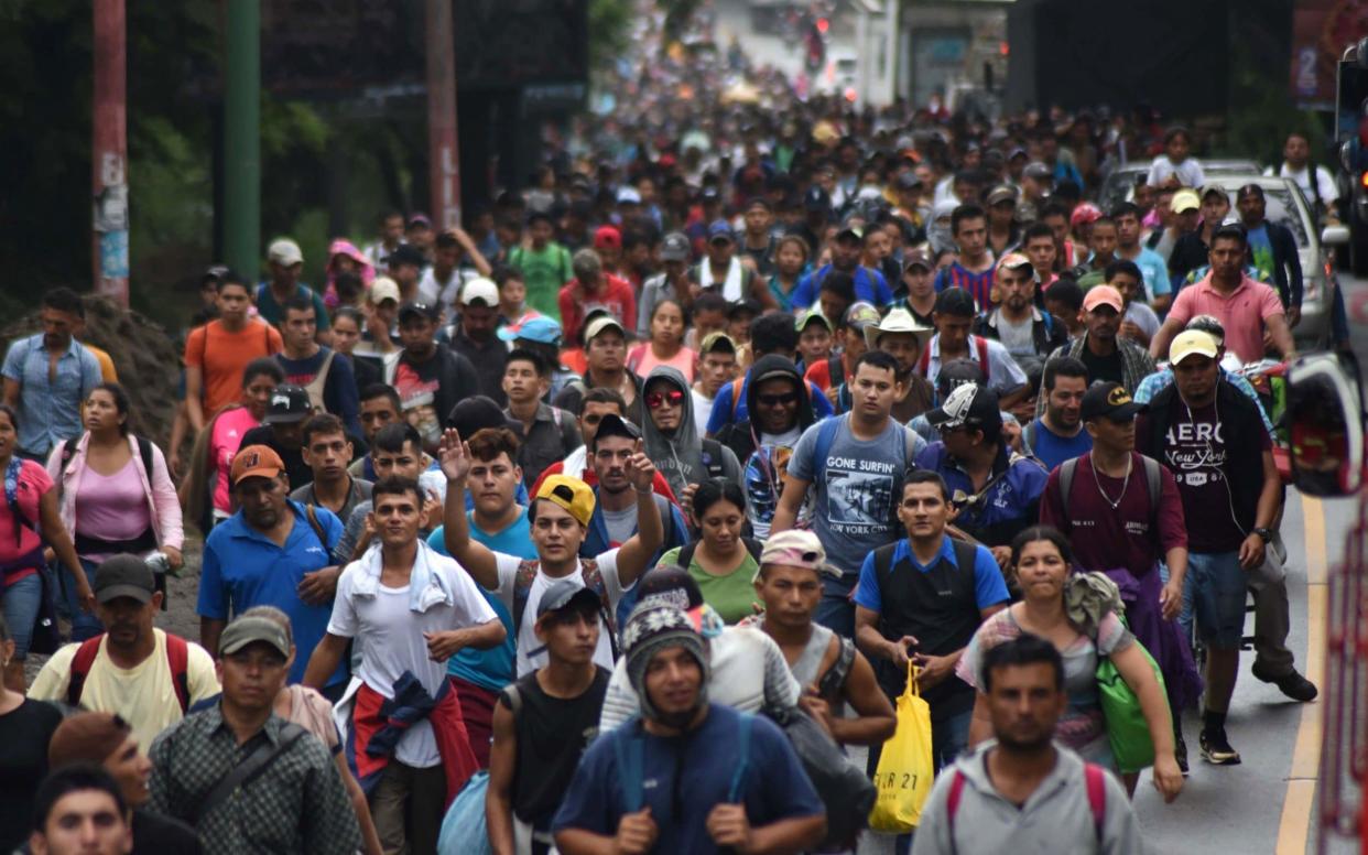 The migrant caravan, pictured passing through Guatemala. It is now believed to be around 3,000 people strong - AFP