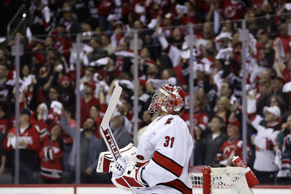 Carolina Hurricanes goaltender Frederik Andersen reacts after giving up a goal to New Jersey Devils center Jack Hughes (not shown) during the first period of Game 4 of an NHL hockey Stanley Cup second-round playoff series Tuesday, May 9, 2023, in Newark, N.J. (AP Photo/Adam Hunger)
