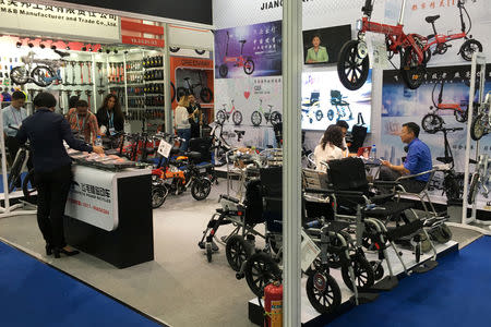 A bicycle and wheelchair manufacturer displays wares during the China Import and Export Fair, also known as Canton Fair, in Guangzhou, Guangdong province, China October 15, 2018. REUTERS/David Stanway