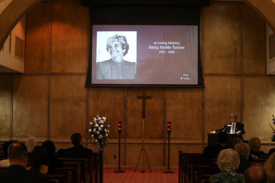 Jay Turner, Betty Turner's son, speaks to a crowd of people during a Celebration of Life at Seaside Memorial Park Saturday, Feb. 10, 2024.