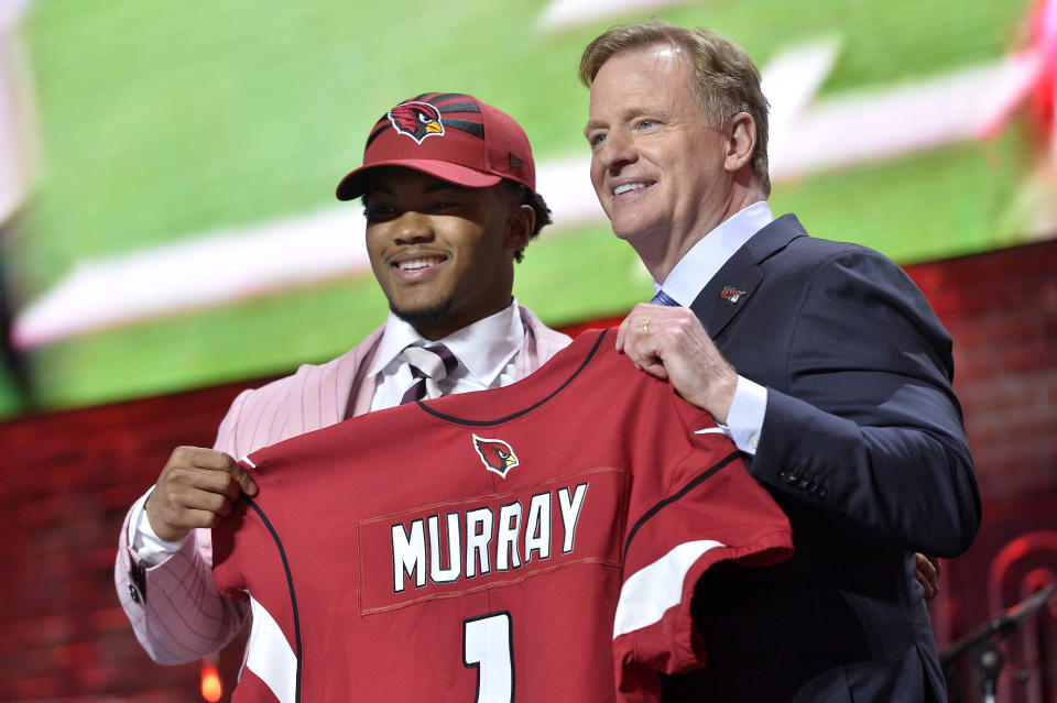 Cardinals quarterback Kyler Murray, left, stands on stage with NFL commissioner Roger Goodell after he was the first pick of the 2019 draft (AP Photo/Brandon Dill)