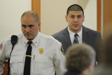 Former New England Patriots football player Aaron Hernandez arrives in the courtroom at Bristol County Superior Court in Fall River, Massachusetts April 1, 2015. Hernandez is accused of the murder of Odin Lloyd in June 2013. REUTERS/Brian Snyder