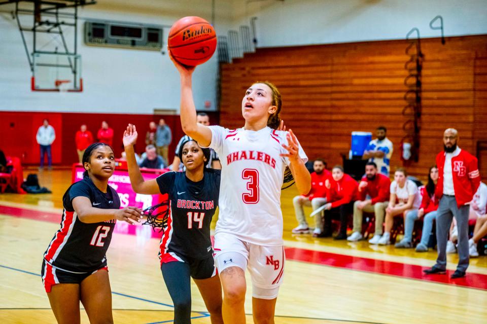 New Bedford's Lexi Thompson floats it in for the Whalers.