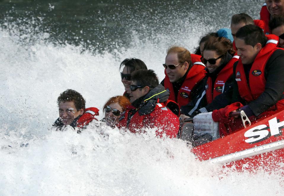 Catherine (centre, 2nd R), Duchess of Cambridge, and her husband, Britain's Prince William (3rd R), laugh as they take a jet-boat ride on the Shotover River in Queenstown April 13, 2014. Prince William and his wife are undertaking a 19-day official visit to New Zealand and Australia with their son, Prince George. REUTERS/Phil Noble (NEW ZEALAND - Tags: ROYALS)