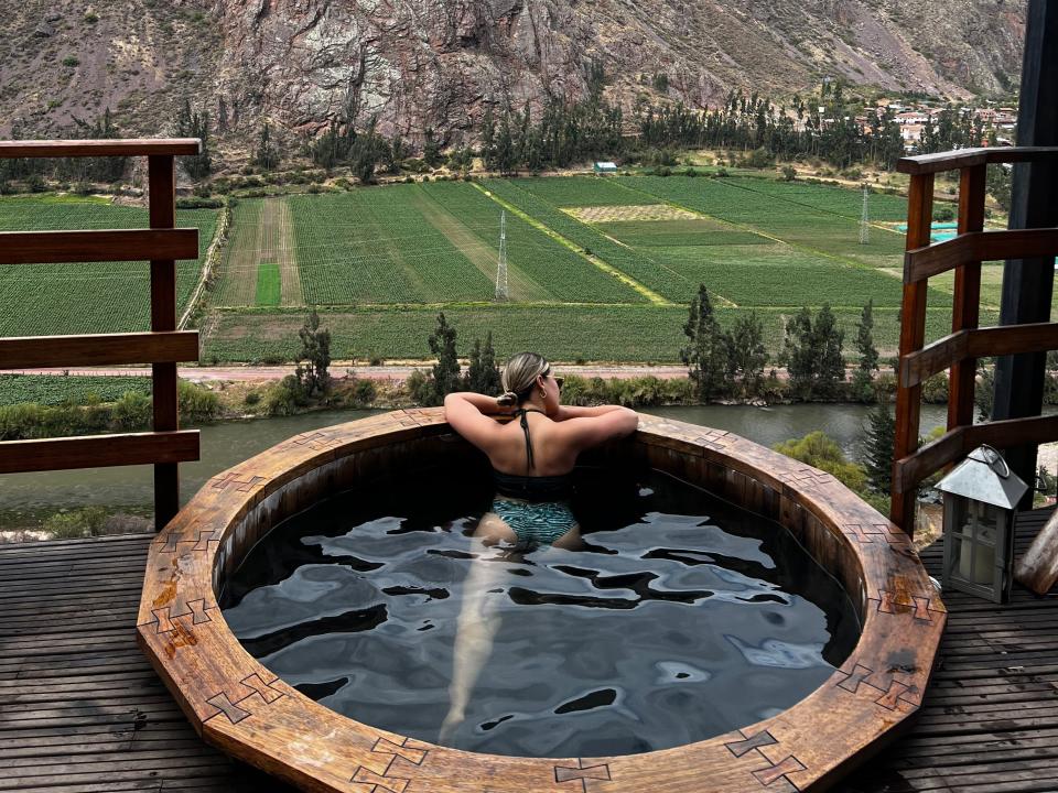 Victoria looks out towards the mountains as she enjoys the jacuzzi.