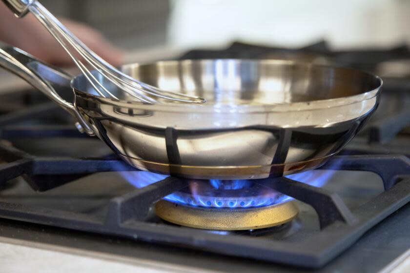 EL SEGUNDO, CA - JUNE 02: The LA City Council unanimously voted to ban gas stoves in new Los Angeles buildings and require only electric stoves and ovens. Cooking columnist Ben Mims tests the difference between the gas burner and electric induction stovetop in the Times kitchen. Photographed on Thursday, June 2, 2022 at LA Times Test Kitchen in El Segundo, CA. (Myung J. Chun / Los Angeles Times)