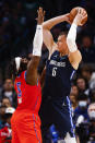 Dallas Mavericks forward Kristaps Porzingis (6) battles Oklahoma City Thunder forward Luguentz Dort (5) for space during the second half of an NBA basketball game, Monday, Jan. 17, 2022, in Dallas. (AP Photo/Brandon Wade)