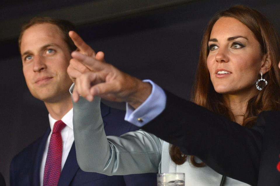 Prince William, Duke of Cambridge (L) and Catherine, Duchess of Cambridge attend the Opening Ceremony of the London 2012 Olympic Games at the Olympic Stadium on July 27, 2012 in London, England. (Photo by Toby Melville - IOPP Pool /Getty Images)