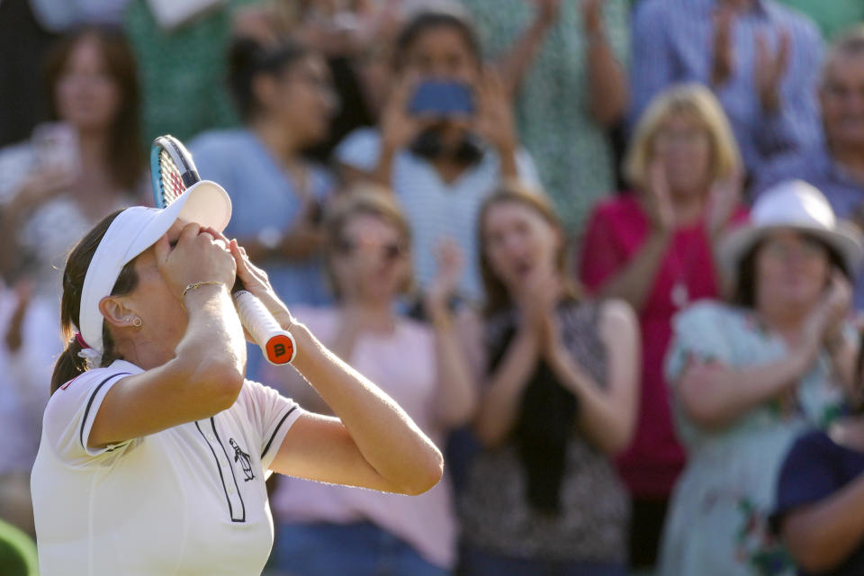 Australia's Ajla Tomljanovic celebrates defeating France's Alize Cornet during a women's singles fourth round match on day eight of the Wimbledon tennis championships in London, Monday, July 4, 2022. (AP Photo/Kirsty Wigglesworth)