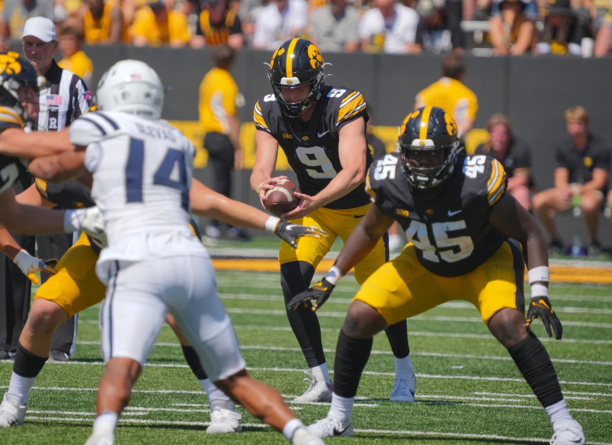 Iowa Hawkeyes punter Tory Taylor (9) kicks the ball as the Hawkeyes take on Utah State at Kinnick Stadium in Iowa City, Saturday, Sept. 2, 2023.