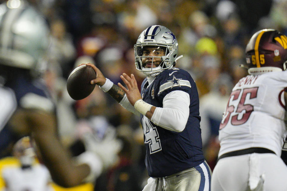 Dallas Cowboys quarterback Dak Prescott (4) looking downfield to pass the ball against the Washington Commanders during the first half of an NFL football game, Sunday, Jan. 7, 2024, in Landover, Md. (AP Photo/Jessica Rapfogel)