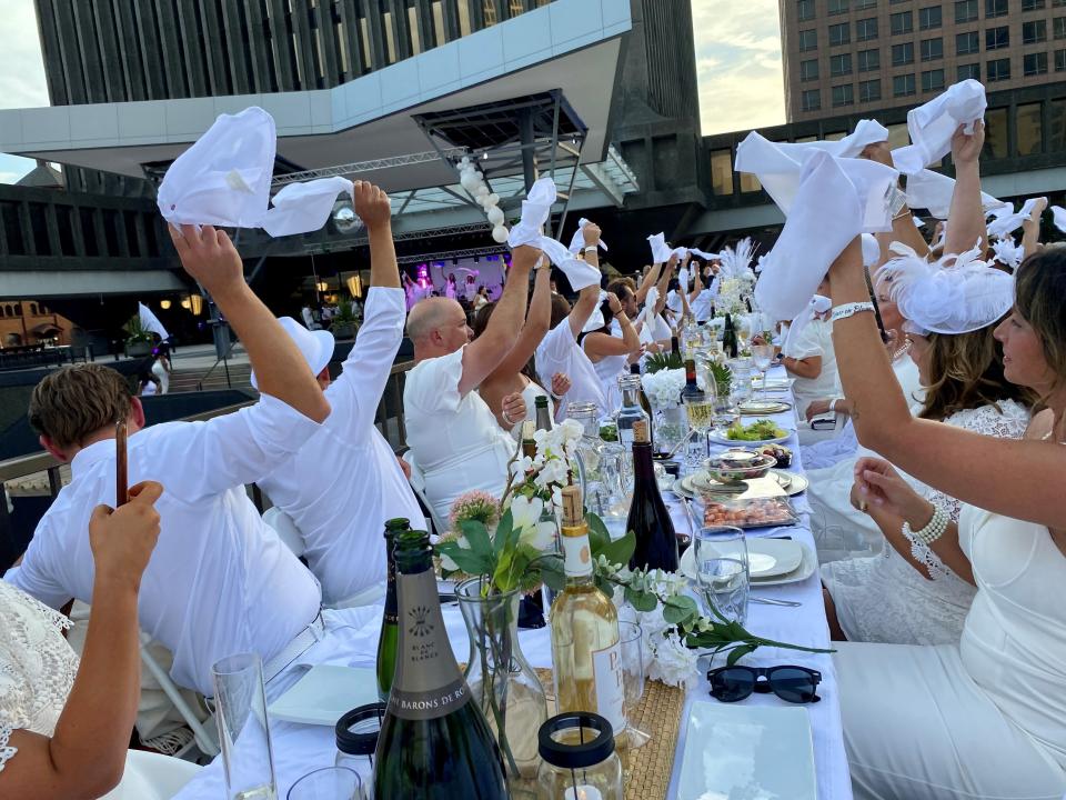 The napkin wave signaled the start of dinner at Rochester's first Diner en Blanc in 2022.