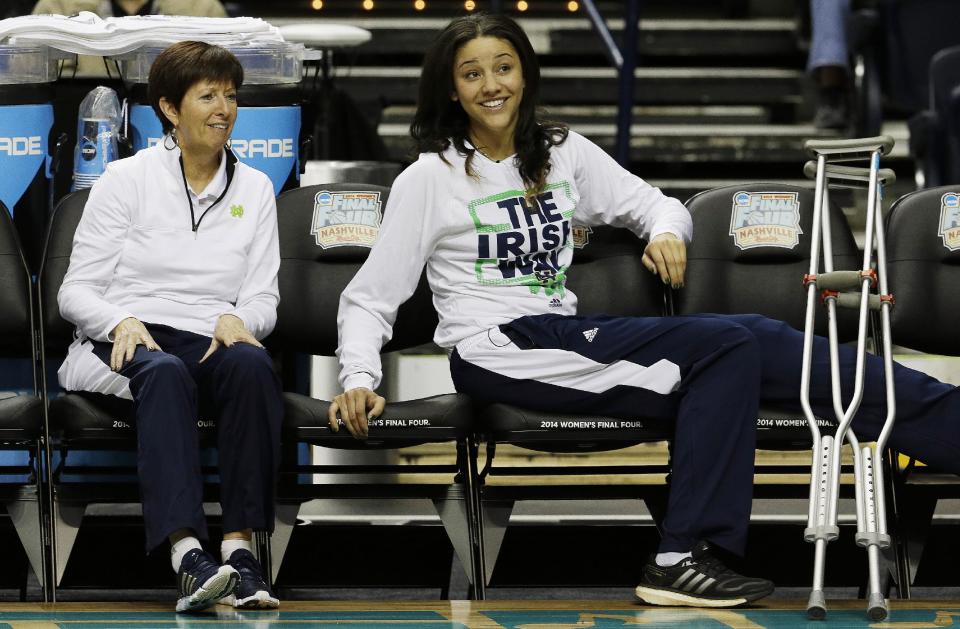 Notre Dame's Natalie Achonwa and Notre Dame head coach Muffet McGraw watch practice before the women's Final Four of the NCAA college basketball tournament, Saturday, April 5, 2014, in Nashville, Tenn. Notre Dame will play Maryland Sunday. (AP Photo/Mark Humphrey)