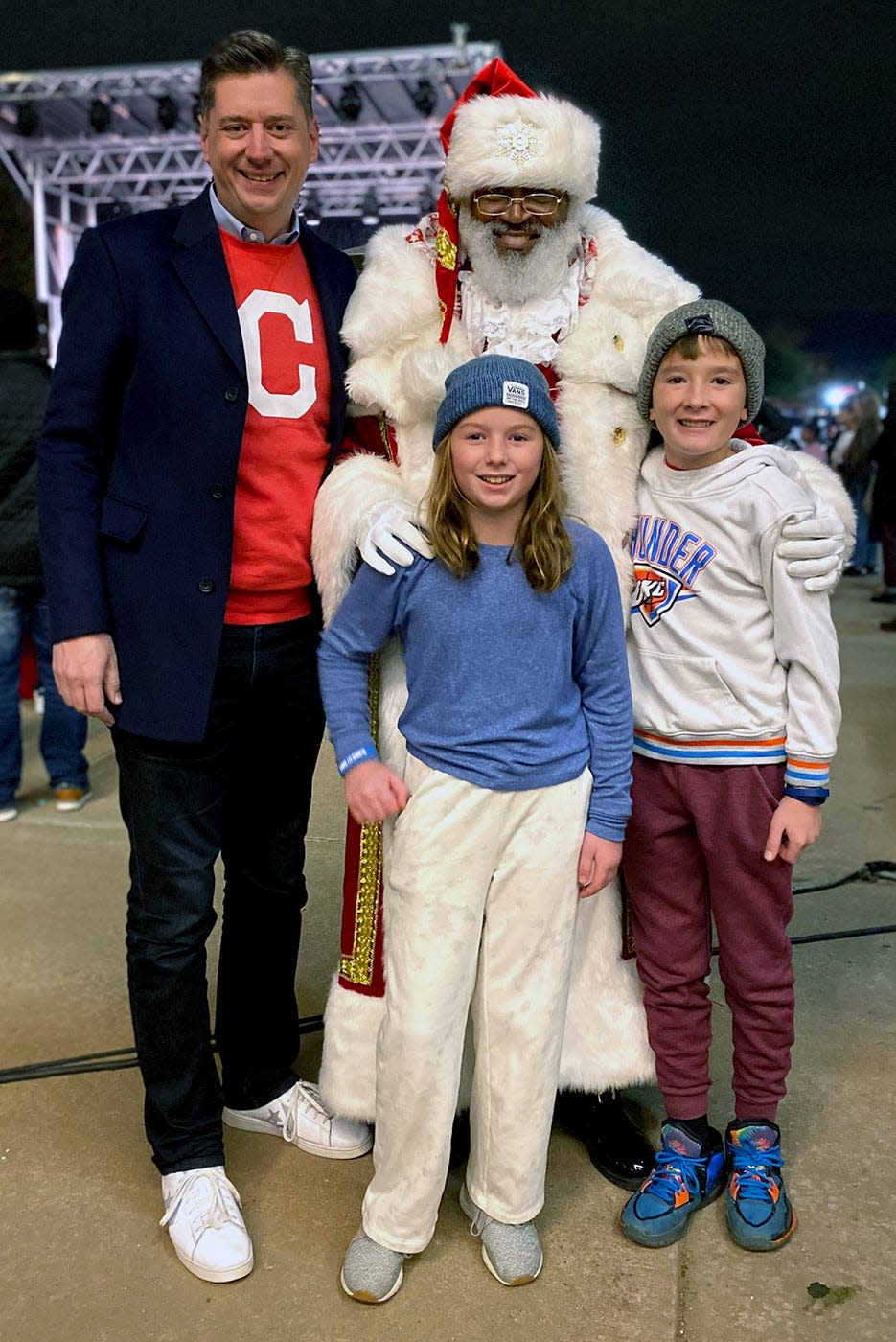 Oklahoma City Mayor David Holt and his children, Margaret and George, pose for a picture with Santa Blair during a holiday-themed event at Scissortail Park.