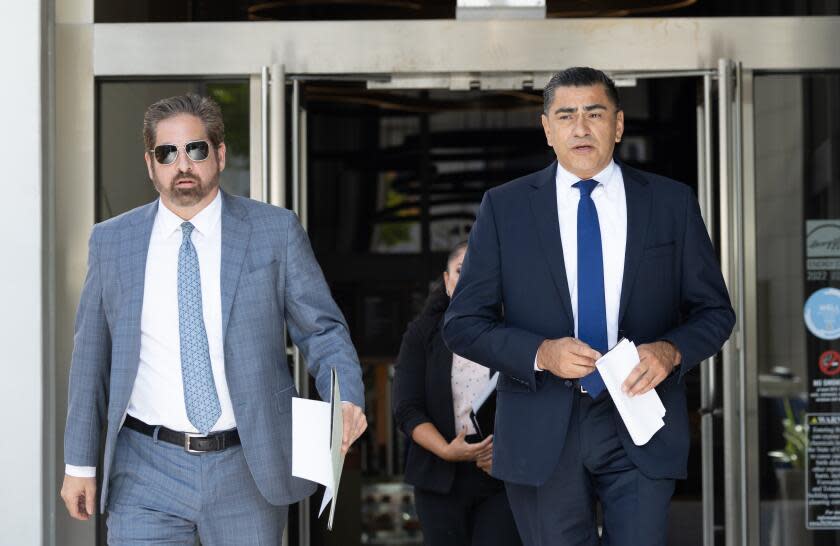 BEVERLY HILLS, CA - October 17: LAPD assistant chief Al Labrada, right, held a news conference with his lawyer Jeremy Tissot regarding allegations of him stalking a lower-ranking officer he was romantically involved with. Photographed at Tissot Law Firm on Tuesday, Oct. 17, 2023 in Beverly Hills, CA. (Myung J. Chun / Los Angeles Times)