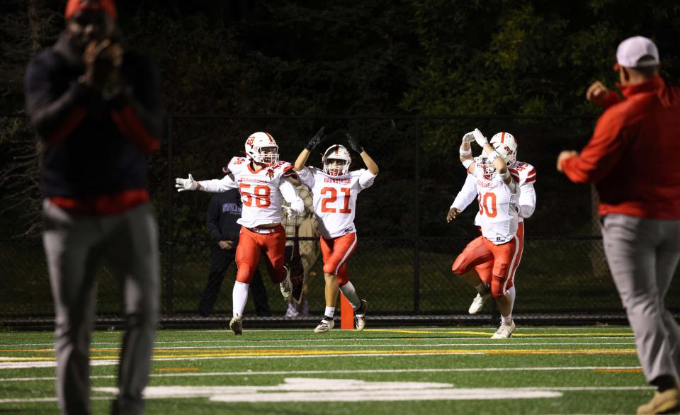 Barnstable defenders from left, Spencer LaValley, Jadus Roderick, Kurt Campbell and Andrew Lovell, celebrate a safety during a game versus Bridgewater-Raynham on Friday, Sept. 23.