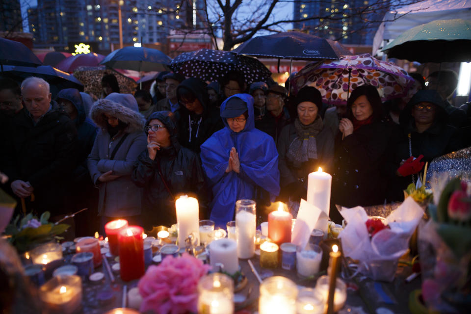 <p>People pray for the victims of the mass killing at a vigil on April 24, 2018 in Toronto, Canada. (Photo: Cole Burston/Getty Images) </p>