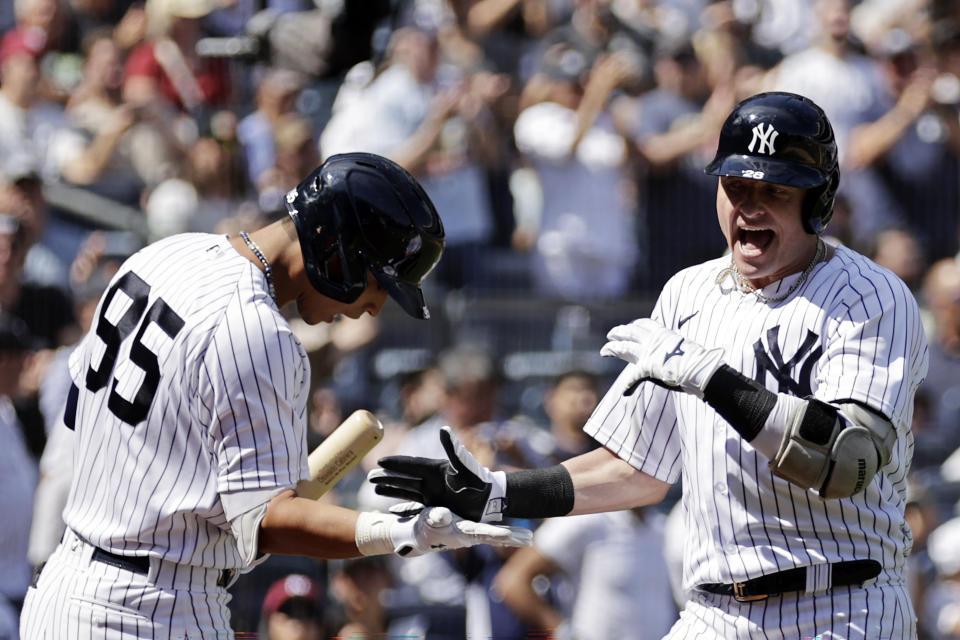 New York Yankees' Josh Donaldson reacts with Oswaldo Cabrera (95) after hitting a home run during the second inning of a baseball game against the Tampa Bay Rays on Saturday, Sept. 10, 2022, in New York. (AP Photo/Adam Hunger)