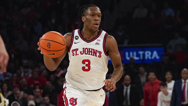 St. John’s Jordan Dingle looks to pass during the first half of an NCAA college basketball game against Michigan in New York, Monday, Nov. 13, 2023. 