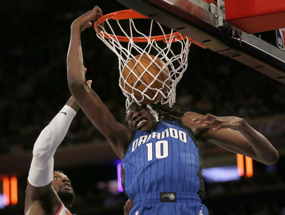 Orlando Magic center Bol Bol dunks (10) over New York Knicks forward Julius Randle during the first half of an NBA basketball game Monday, Oct. 24, 2022, in New York. (AP Photo/John Munson)