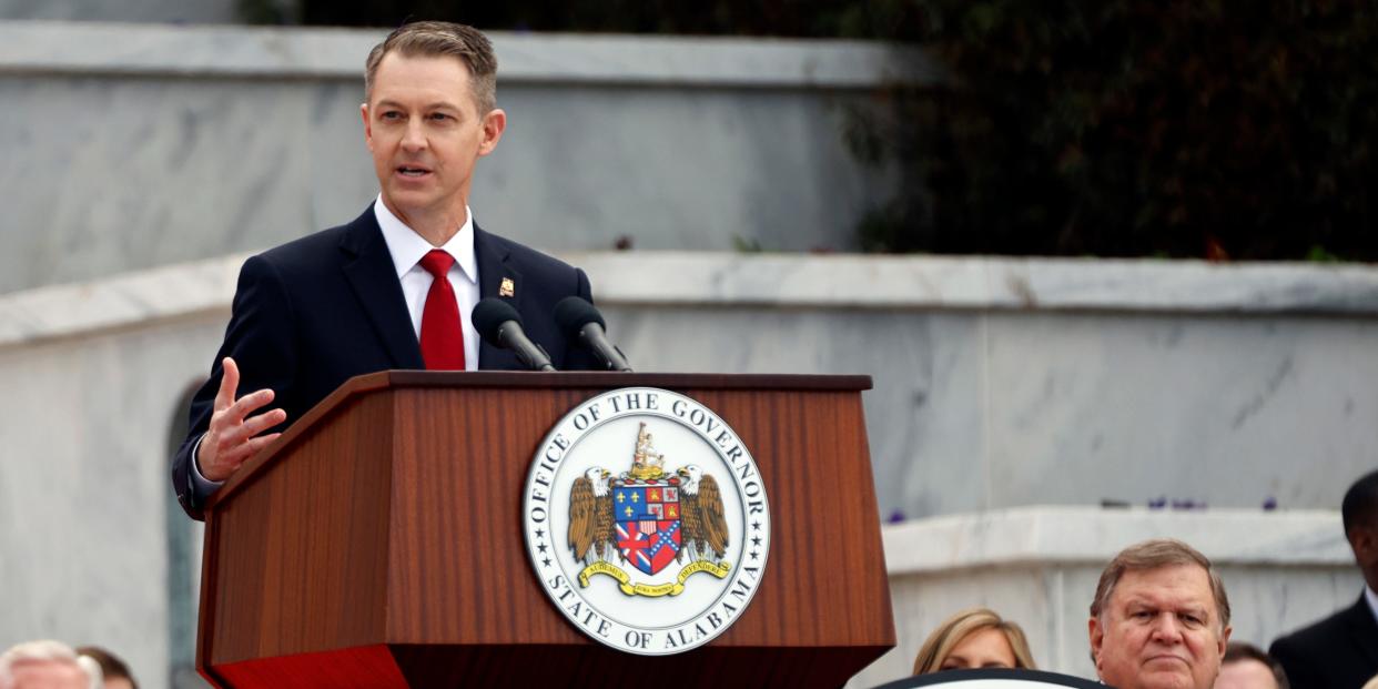 guy in suit behind podium